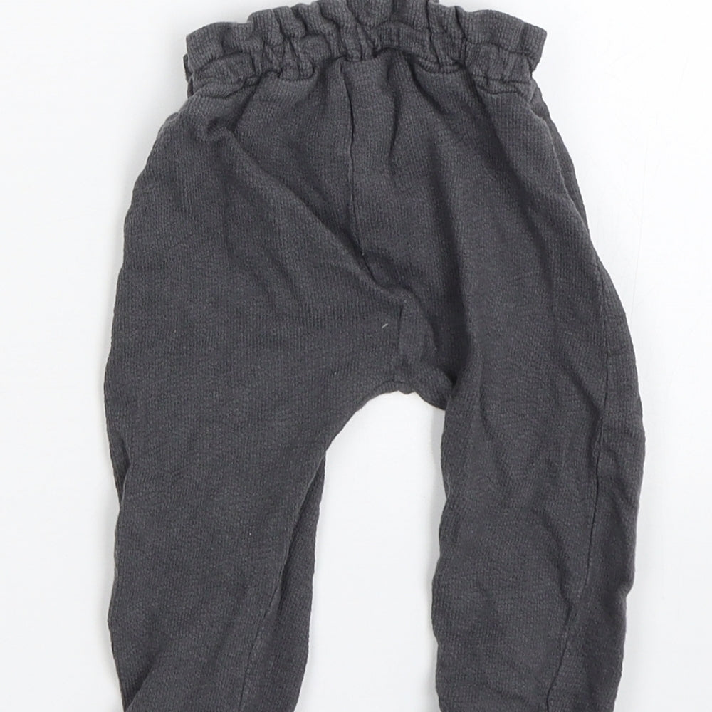 Brand and care label for George Baby Grey sweatpants, size 6-9, Months