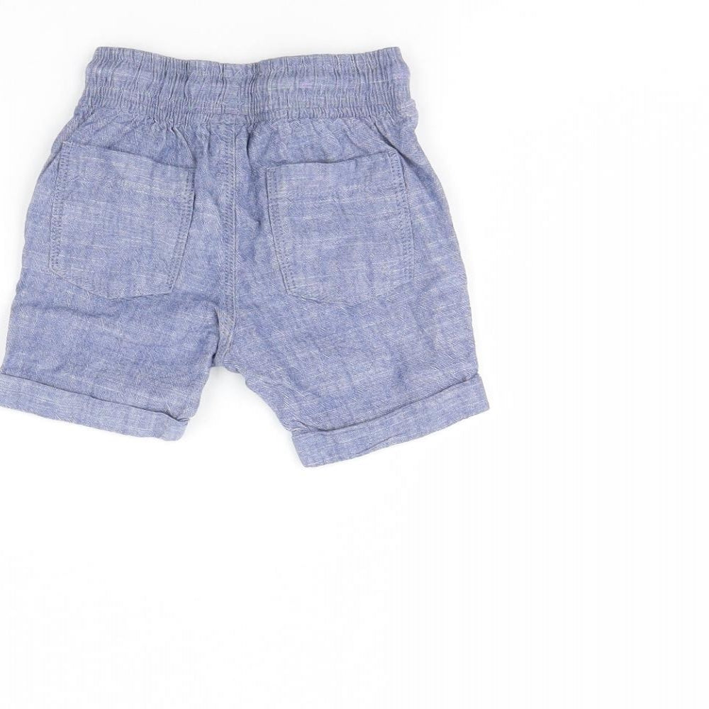 Brand and care label for Tu Baby Blue Denim Cropped Trousers, size 12, Months