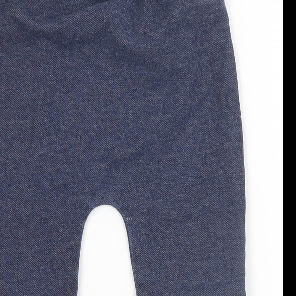 Brand and care label for Preworn boys’ blue jogger jeans, size 6-9, months