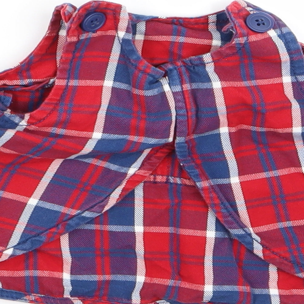 Brand and care label for Polarn O. Pyret girls’ multicoloured check fit & flare, size 0-3, months