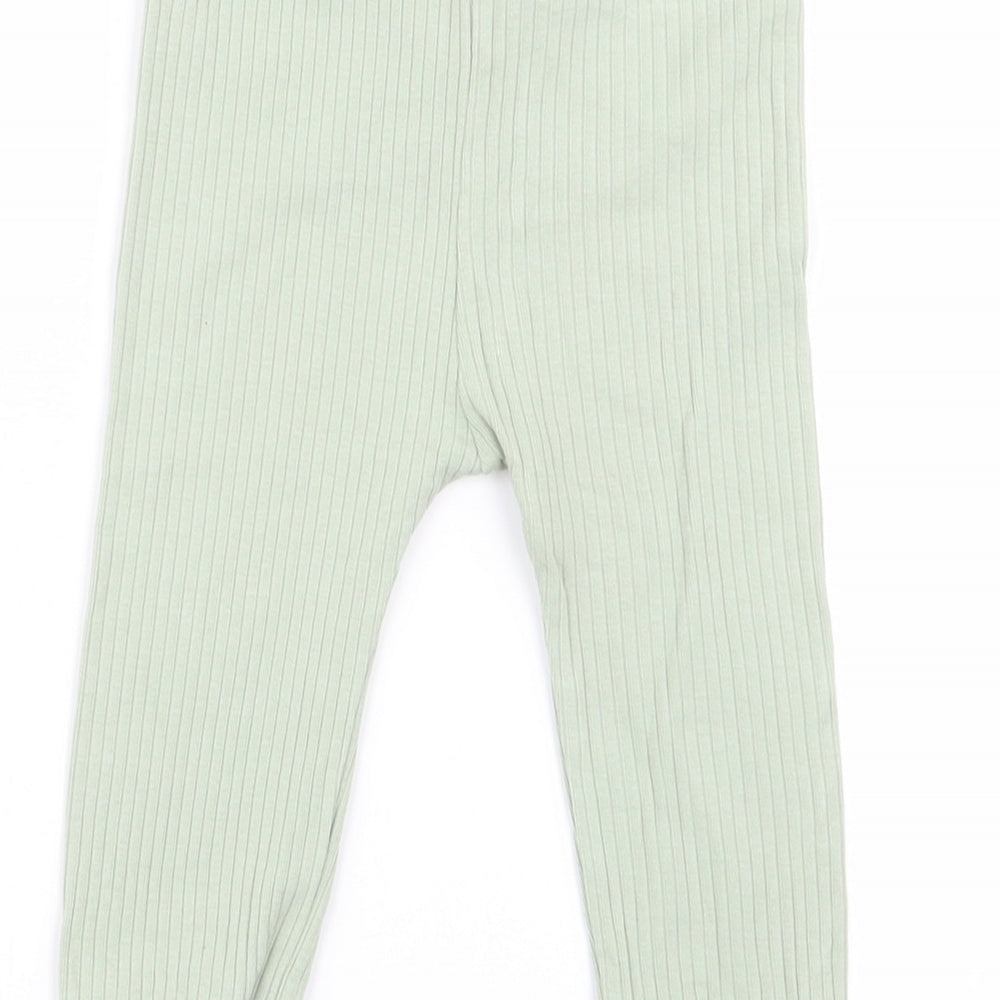 Brand and care label for Tu girls’ green jogger trousers, size 6-9, months - leggings