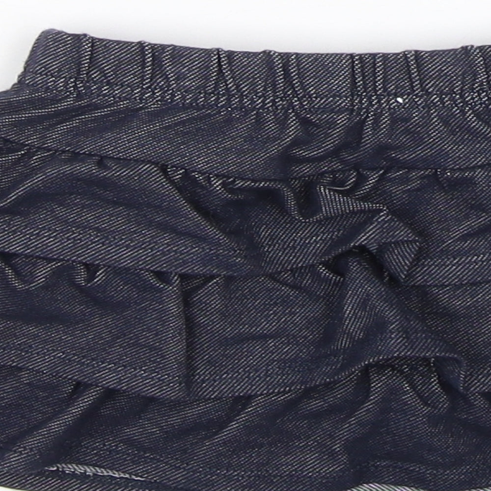 Brand and care label for Garnanimals girls’ blue flare skirt, size 12, months