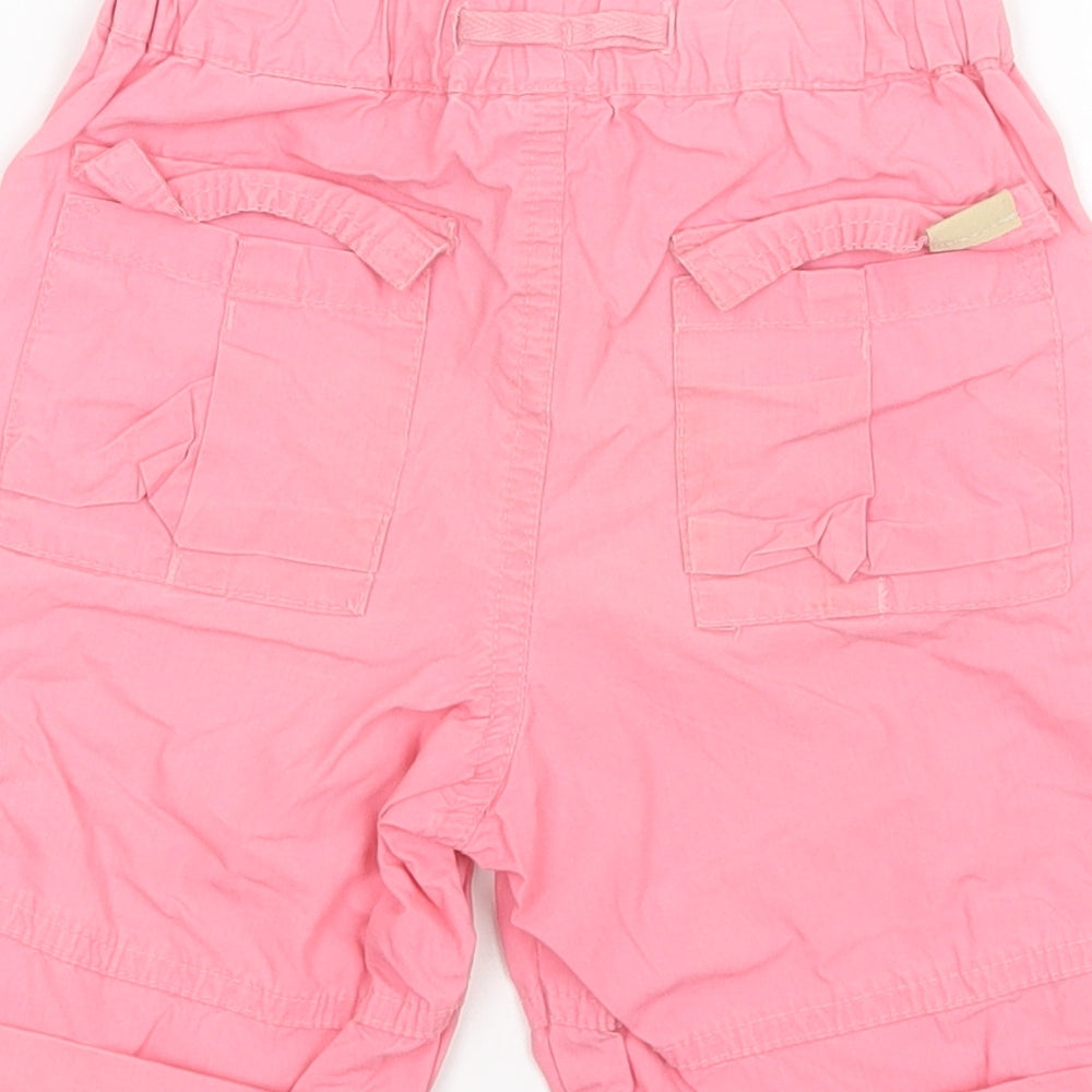 Brand and care label for L.O.G.G girls’ pink cargo trousers, size 9-12, months