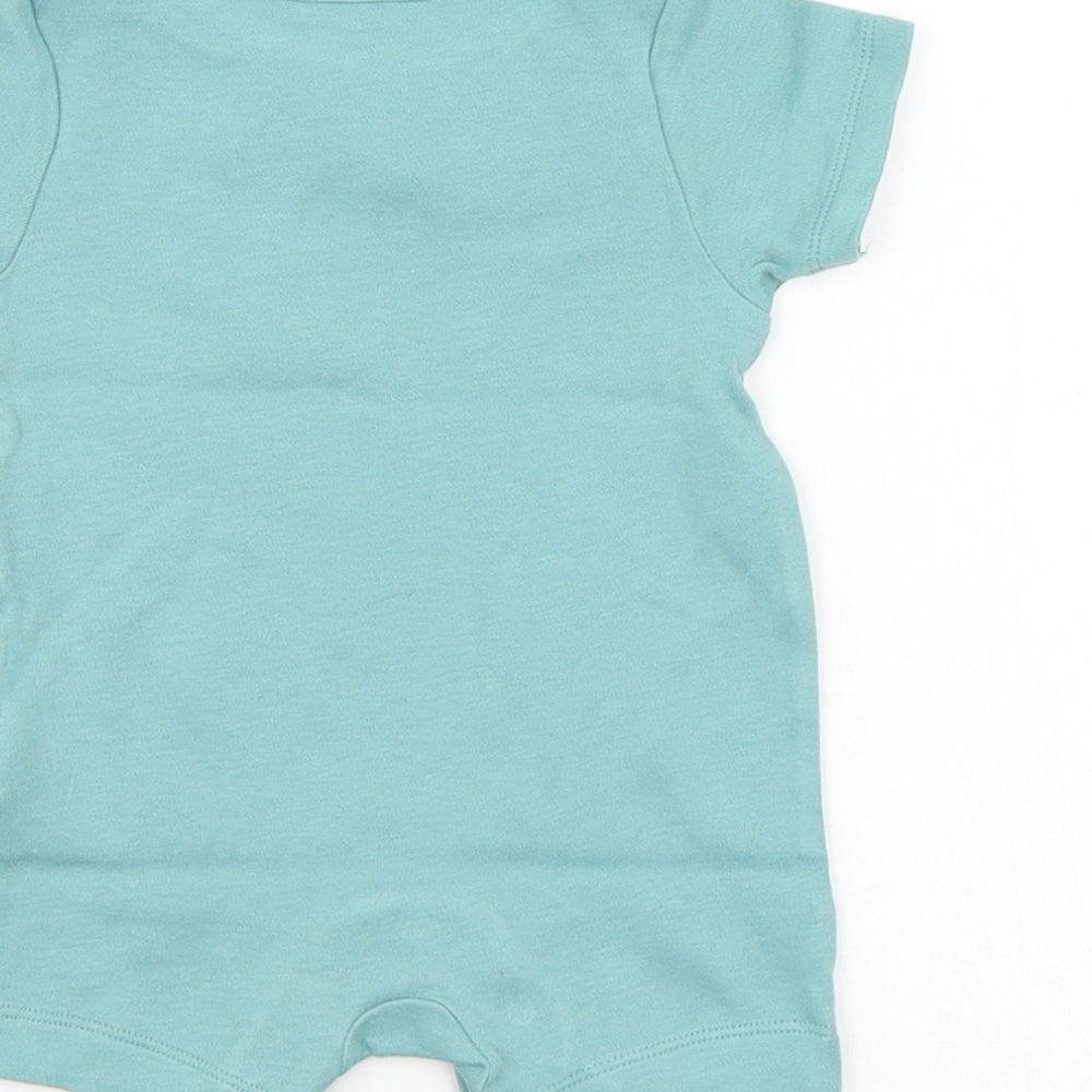 Brand and care label for Marks & Spencer boys’ green babygrow one-piece, size 0-3, months