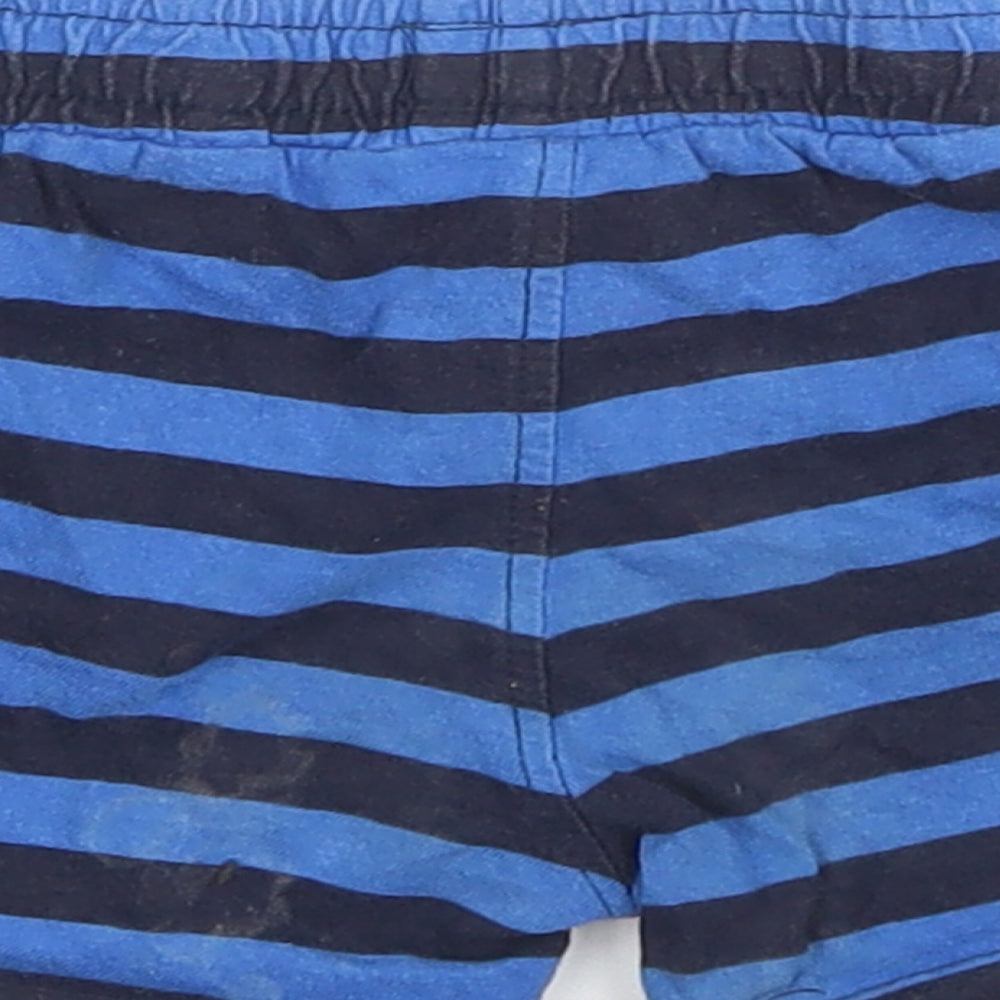 Brand and care label for Baby boys’ blue striped sweatpants, size 9-12, months