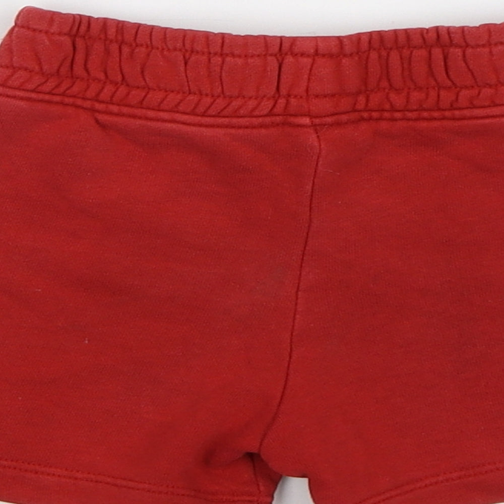 Brand and care label for Tu Baby Red Cropped Trousers, size 9-12, Months