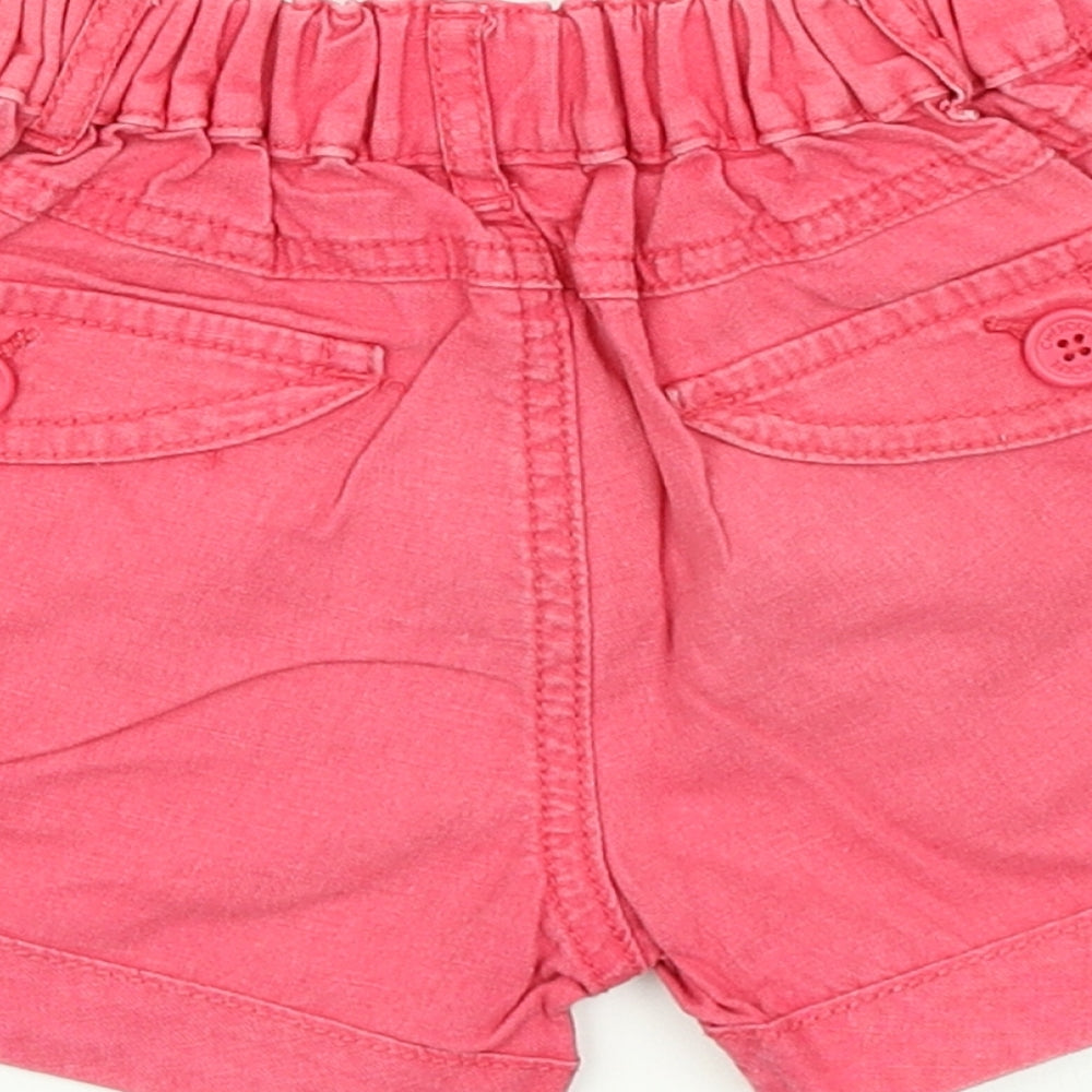 Brand and care label for Cherokee girls’ pink cropped trousers, size 18-24, months