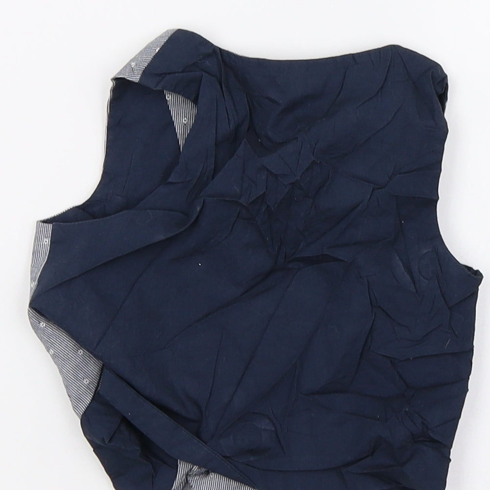 Brand and care label for Primark boys’ blue tuxedo suit waistcoat, size 12-18, months