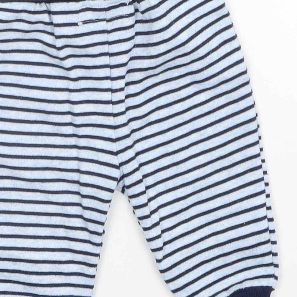 Brand and care label for Early Days boys’ blue striped sweatpants, size 3-6, months