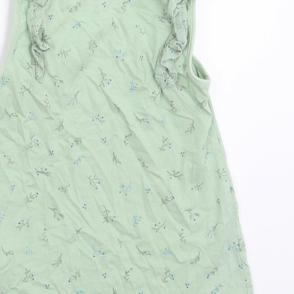 Brand and care label for Next girls’ green floral basic tank, size 5-6, years
