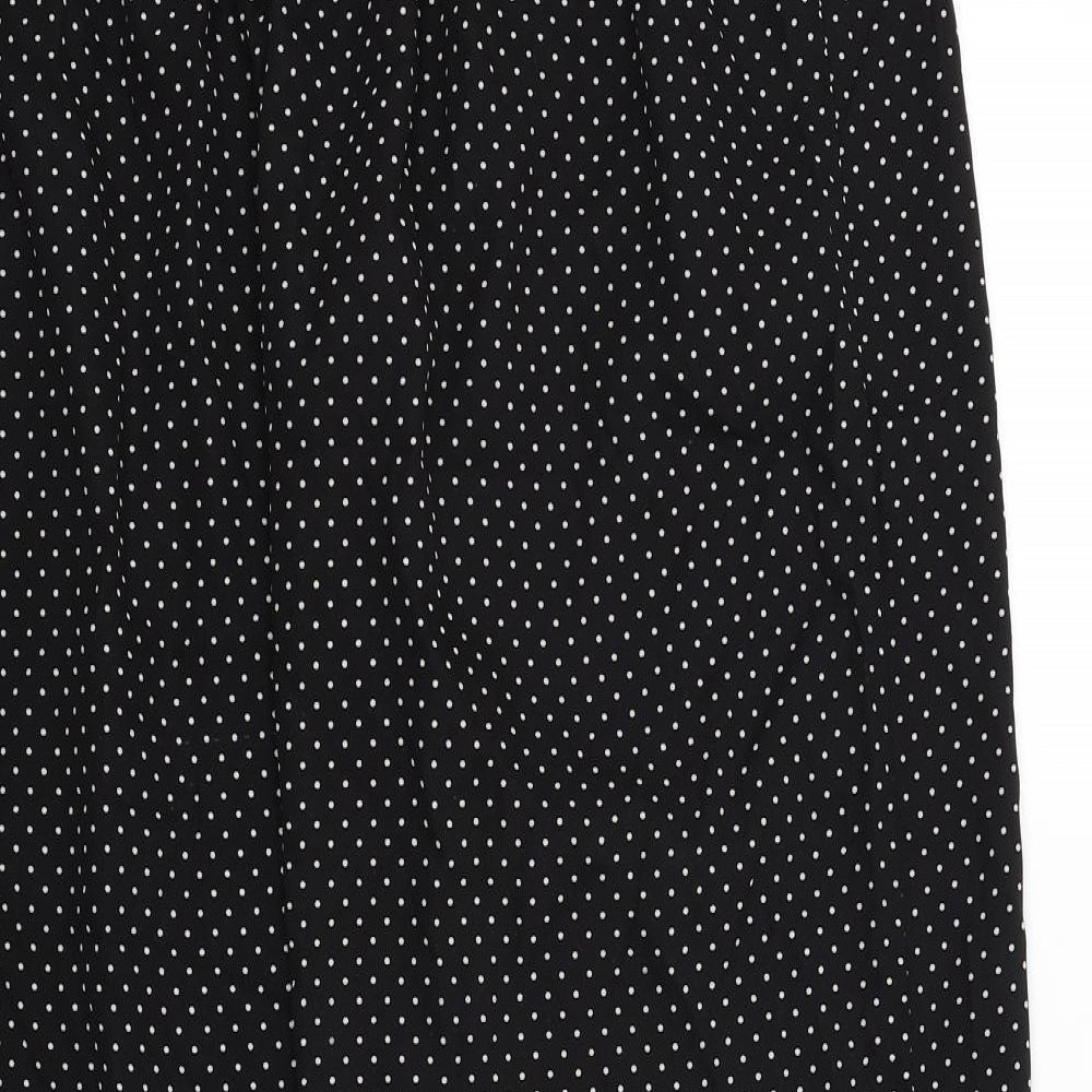 Brand and care label for ORIGINALS women’s black polka dot trousers, size M, 27-inch leg