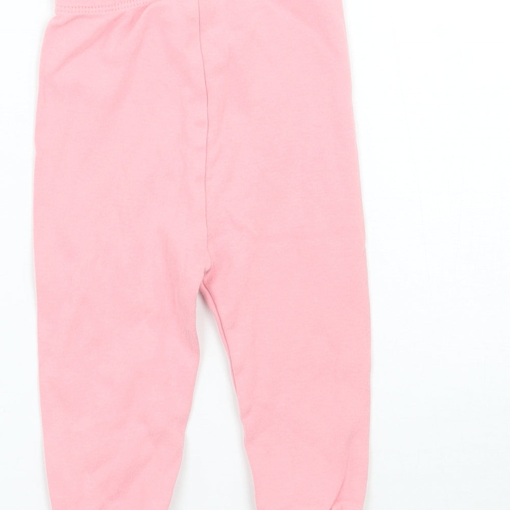 Brand and care label for George girls’ pink sweatpants, size 9, months