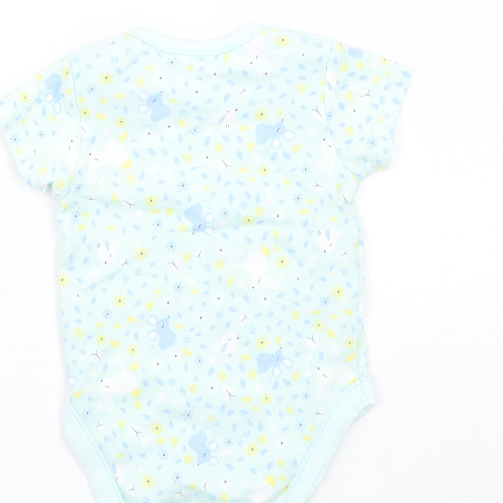 Brand and care label for George girls’ green floral babygrow one-piece, size 0-3, months