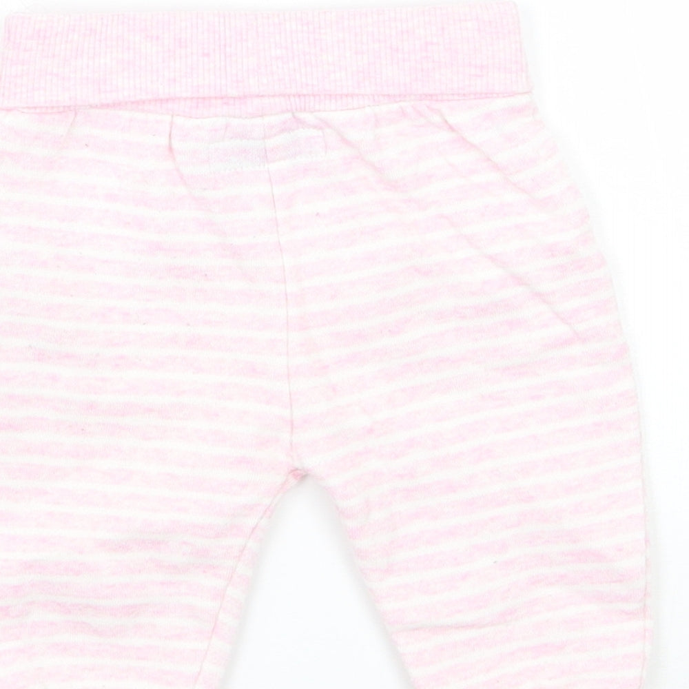 Brand and care label for Early Days girls’ pink striped sweatpants, size 0-3, months