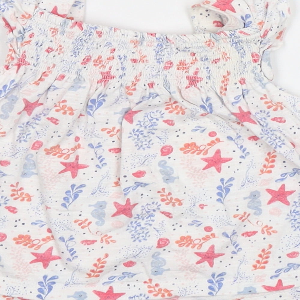 Brand and care label for F&F Baby White Floral Tunic Blouse, size 3-6, Months