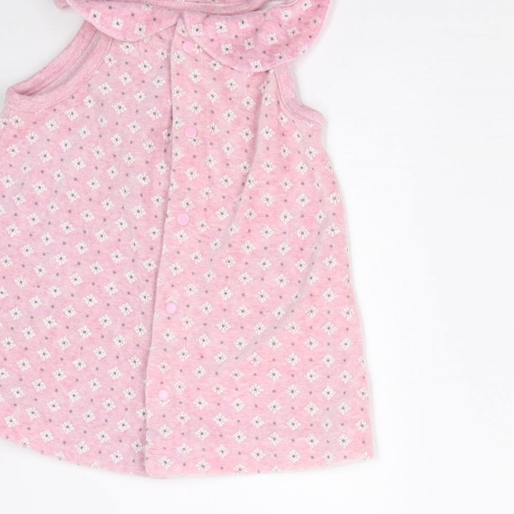 Brand and care label for Kanz girls’ pink geometric pinafore/dungaree dress, size 3-6, months