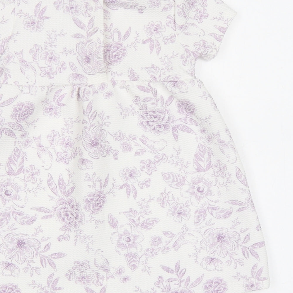 Brand and care label for Tu Baby White Floral A-Line, size 3-6, Months