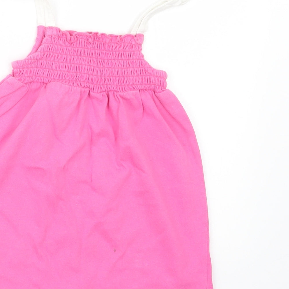 Brand and care label for Marks & Spencer girls’ pink t-shirt dress, size 9-12, months