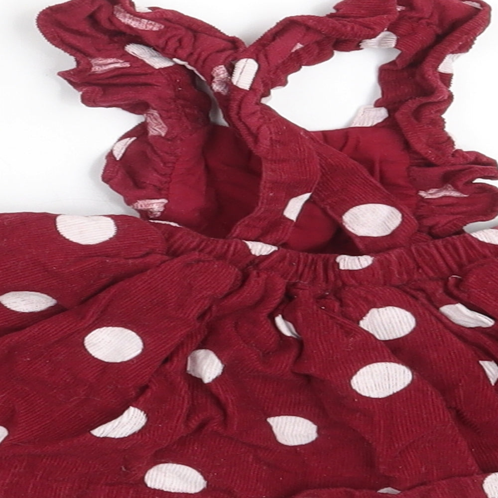 Brand and care label for Matalan girls’ purple polka dot corduroy fit & flare, size 0-3, months