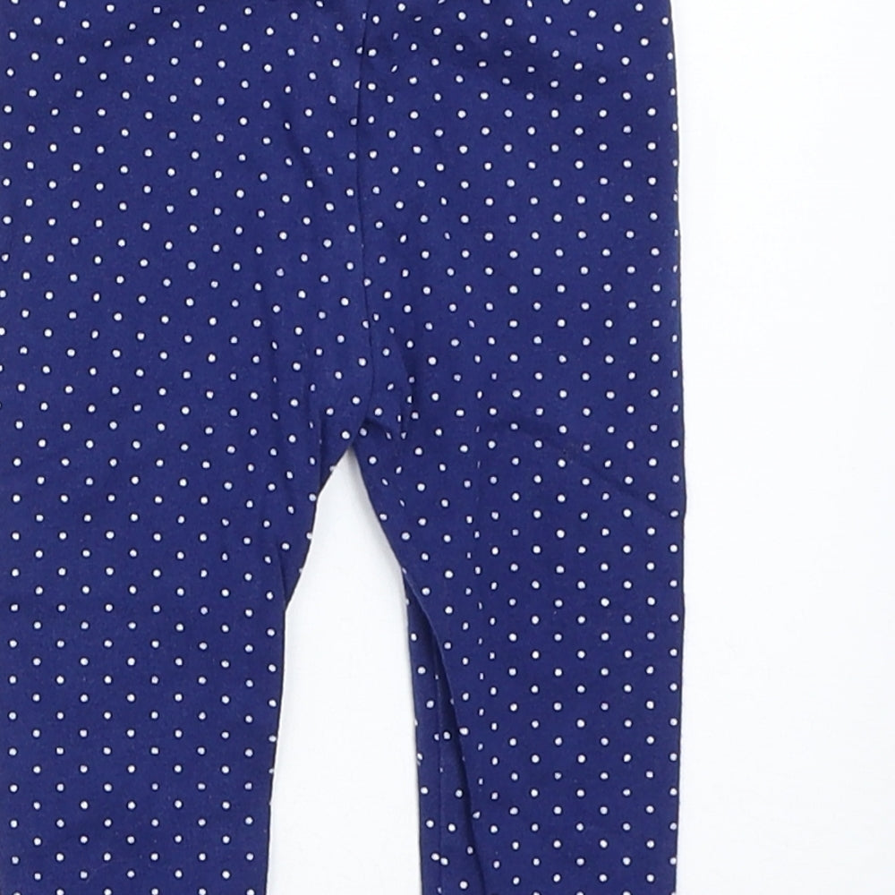 Brand and care label for George girls’ blue spotted capri trousers, size 6-9, months