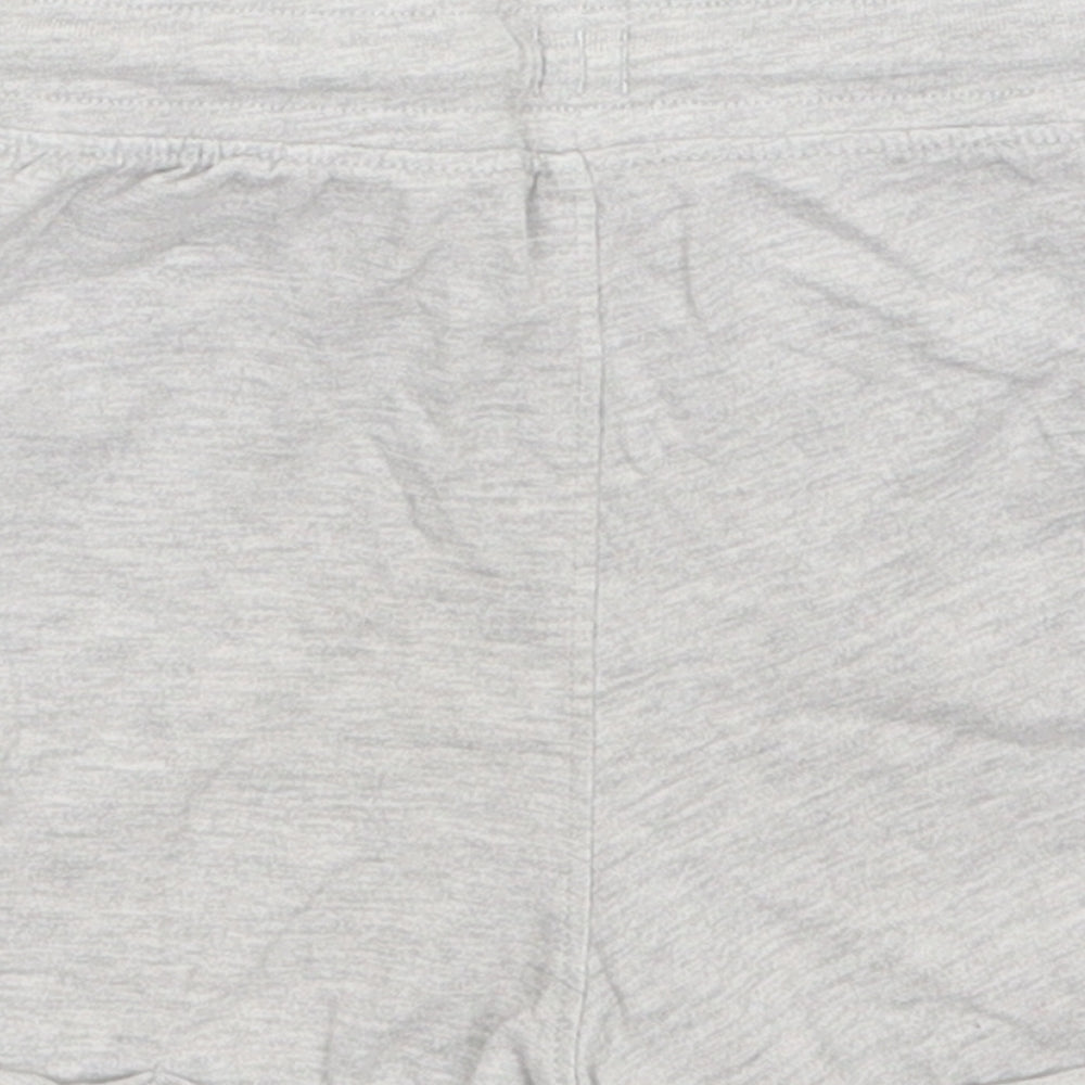 Brand and care label for Nutmeg boys’ grey sweatpants, size 18-24, months