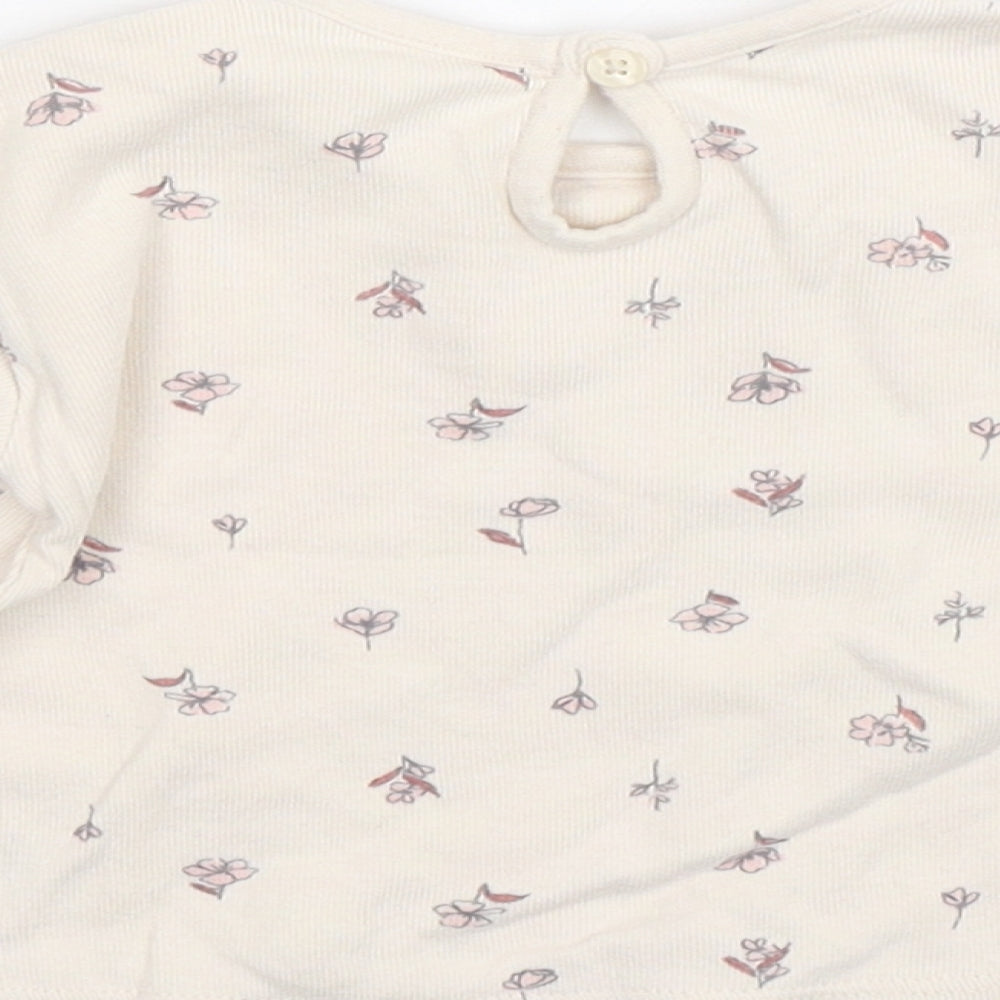 Brand and care label for George girls’ beige floral basic t-shirt, size 3-6, months
