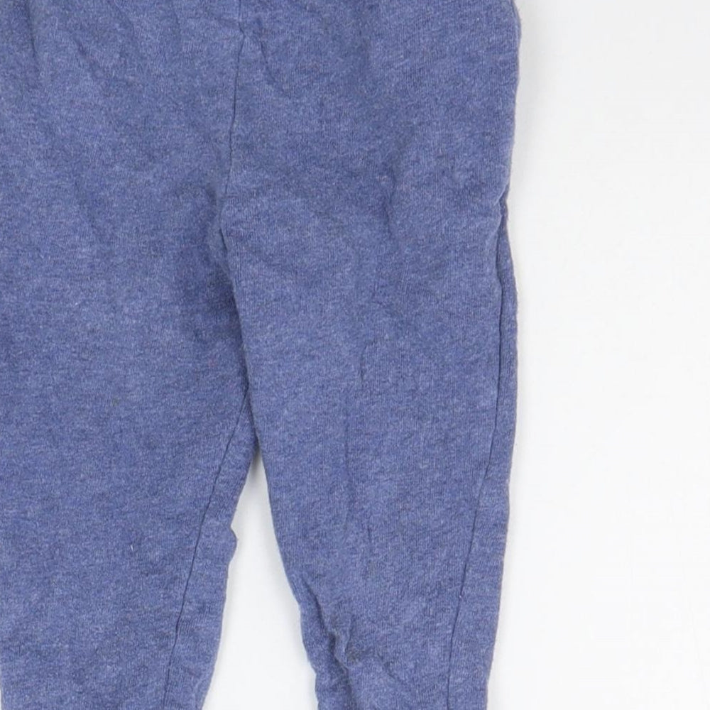 Brand and care label for Mothercare girls’ blue jogger trousers, size 12-18, months