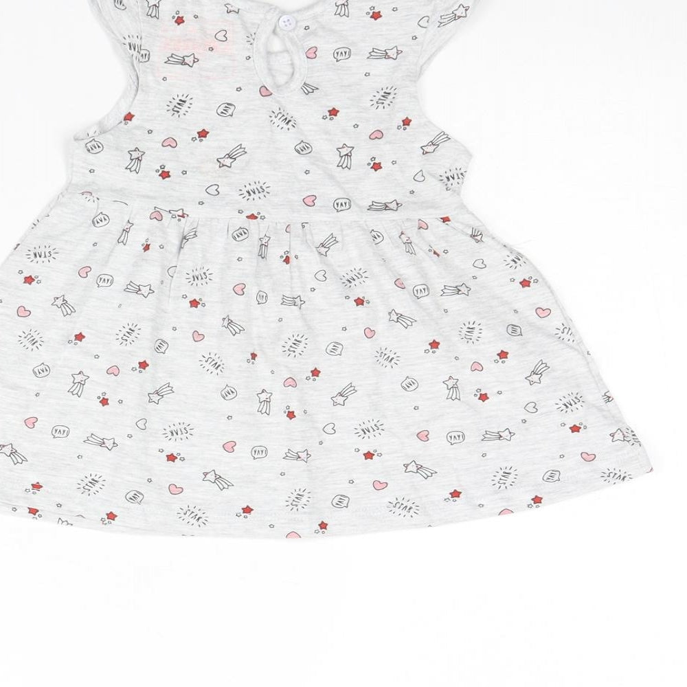 Brand and care label for Primark girls’ grey spotted fit & flare, size 3-6, months