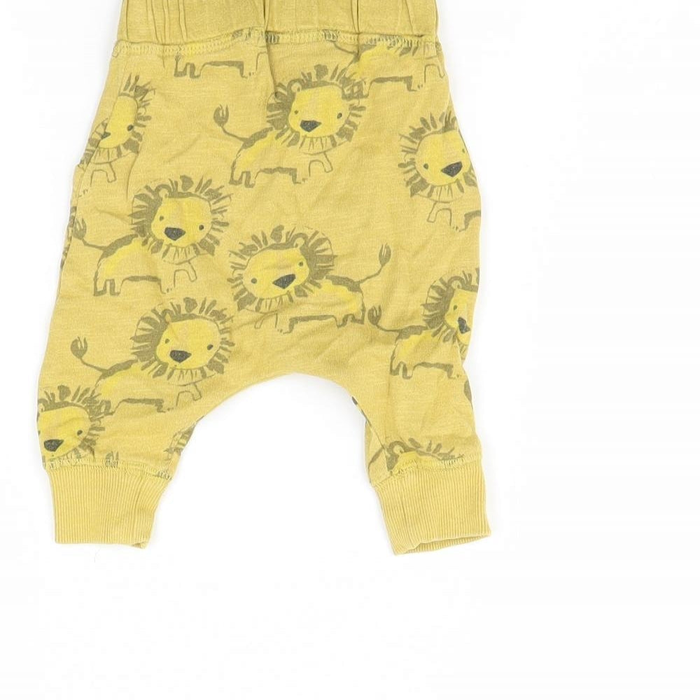 Brand and care label for Next Baby Yellow Animal Print Jogger Trousers, size 0-3, Months - lion