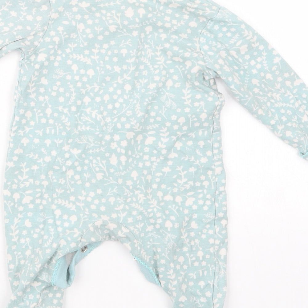 Brand and care label for George girls’ green geometric babydoll one piece, size 3-6, months