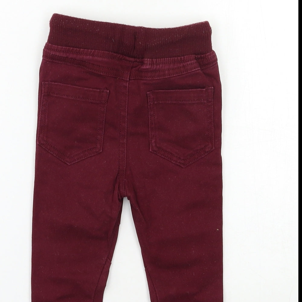 Brand and care label for BHS Baby Red Denim Cargo Jeans, size 9-12, Months