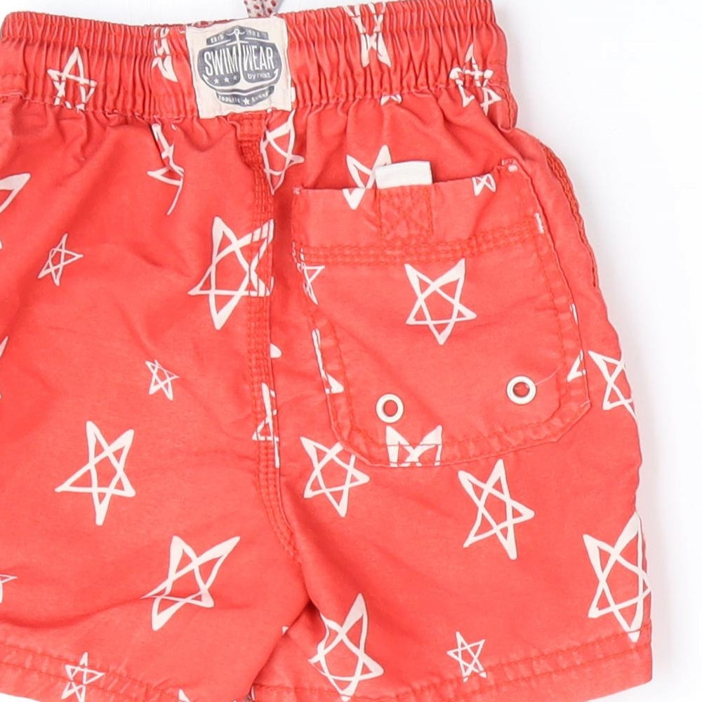 Brand and care label for Next boys’ red cropped trousers, size 18-24, months - start print shorts