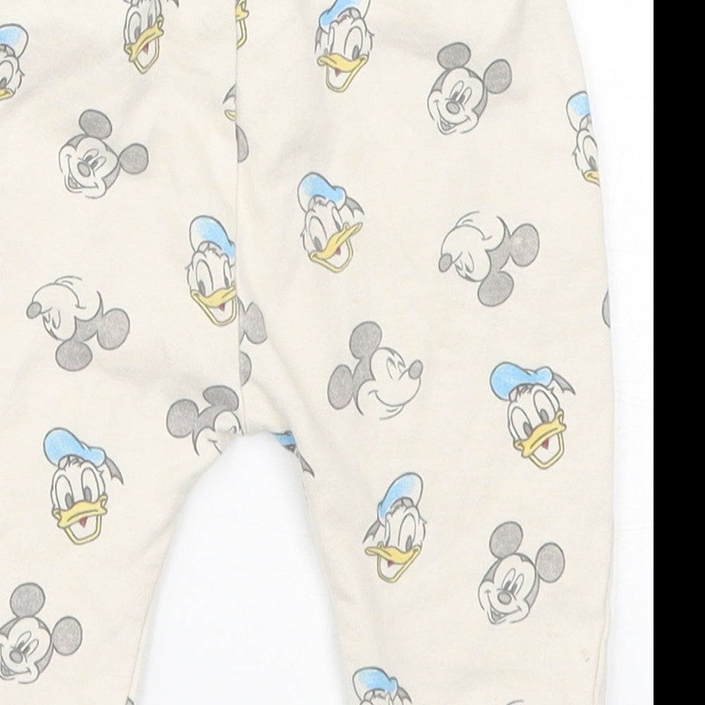 Brand and care label for George Baby Beige sweatpants, size 3-6, Months - Mickey Mouse Donald Duck