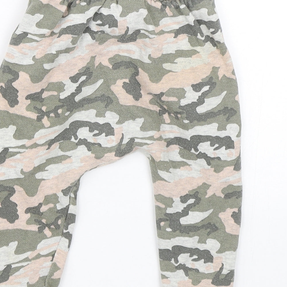 Brand and care label for Next girls’ multicoloured camouflage sweatpants, size 12-18, months