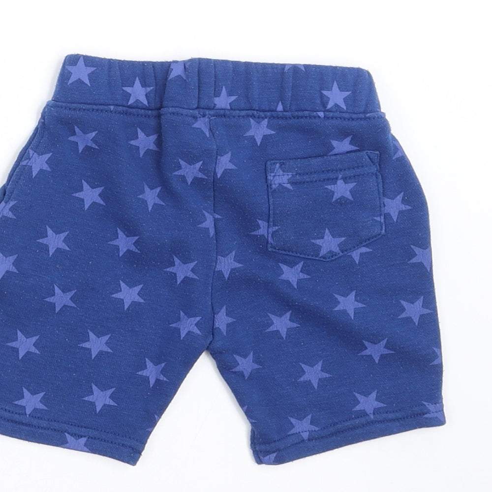 Brand and care label for Primark boys’ blue geometric trousers, size 12-18, months - star pattern shorts