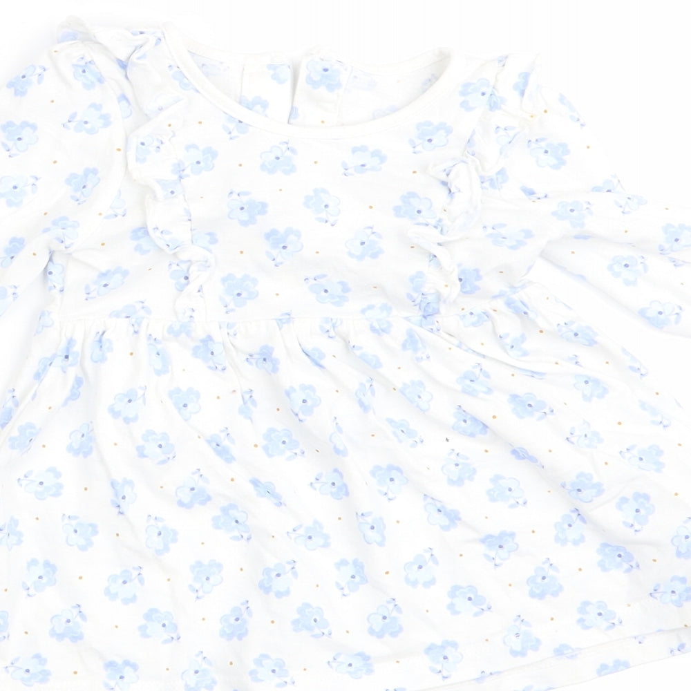 Brand and care label for Matalan girls’ blue floral a-line, size 3-6, months