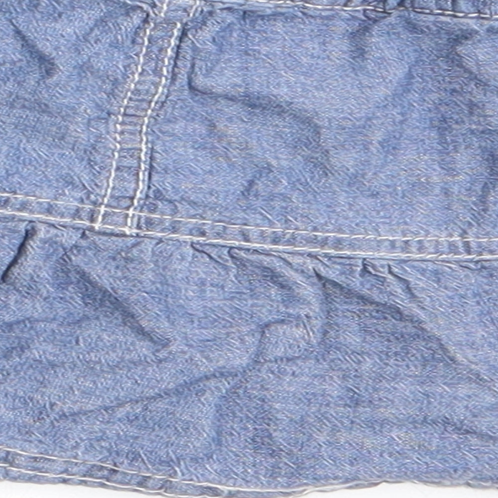 Brand and care label for George girls’ blue a-line skirt, size 3-6, months