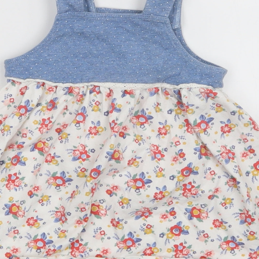 Brand and care label for Nutmeg girls’ multicoloured floral pinafore/dungaree dress, size 3-6, months