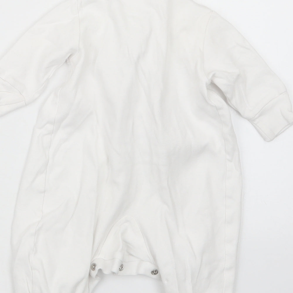 Brand and care label for Next girls’ white coverall outfit/set, size 0-3, months