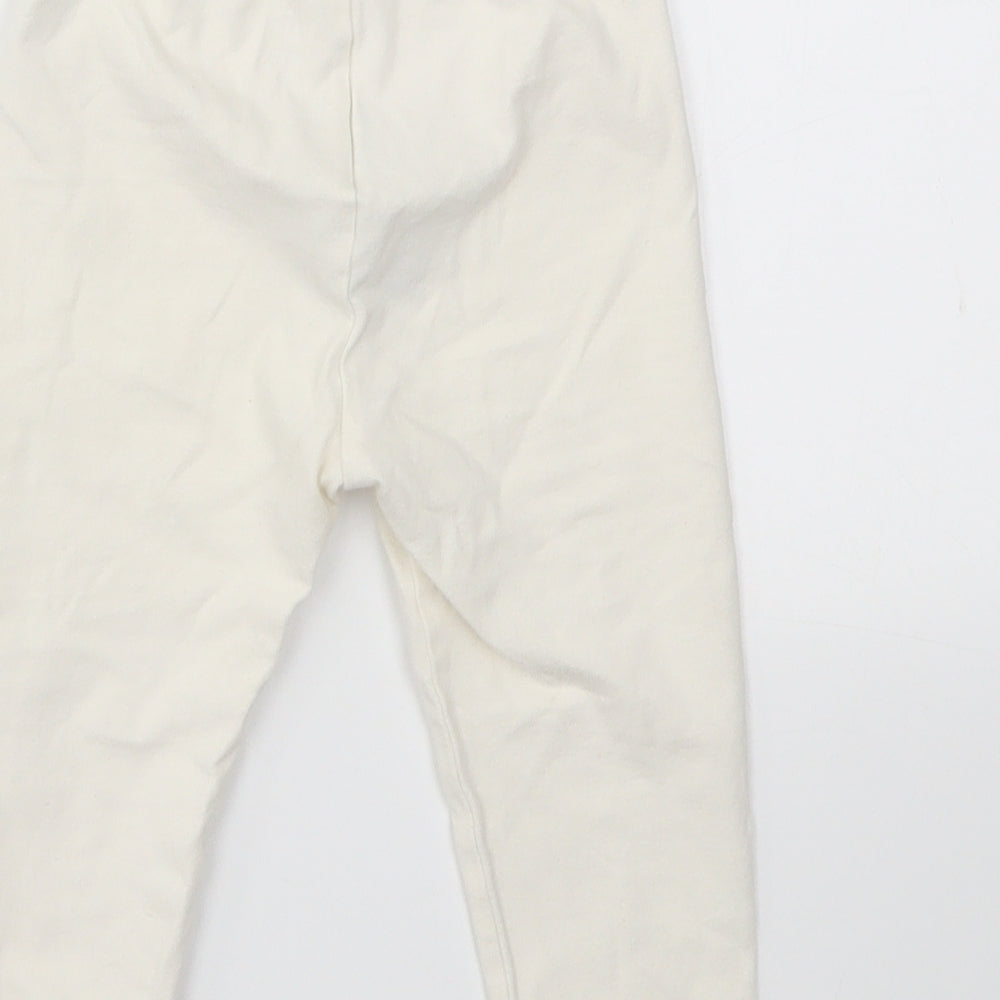 Brand and care label for Gap Baby Ivory Capri Leggings, size 12-18, Months