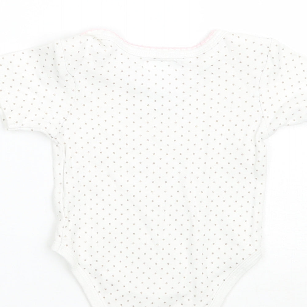 Brand and care label for Pitter Patter girls’ white polka dot babygrow one-piece, size 3-6, months