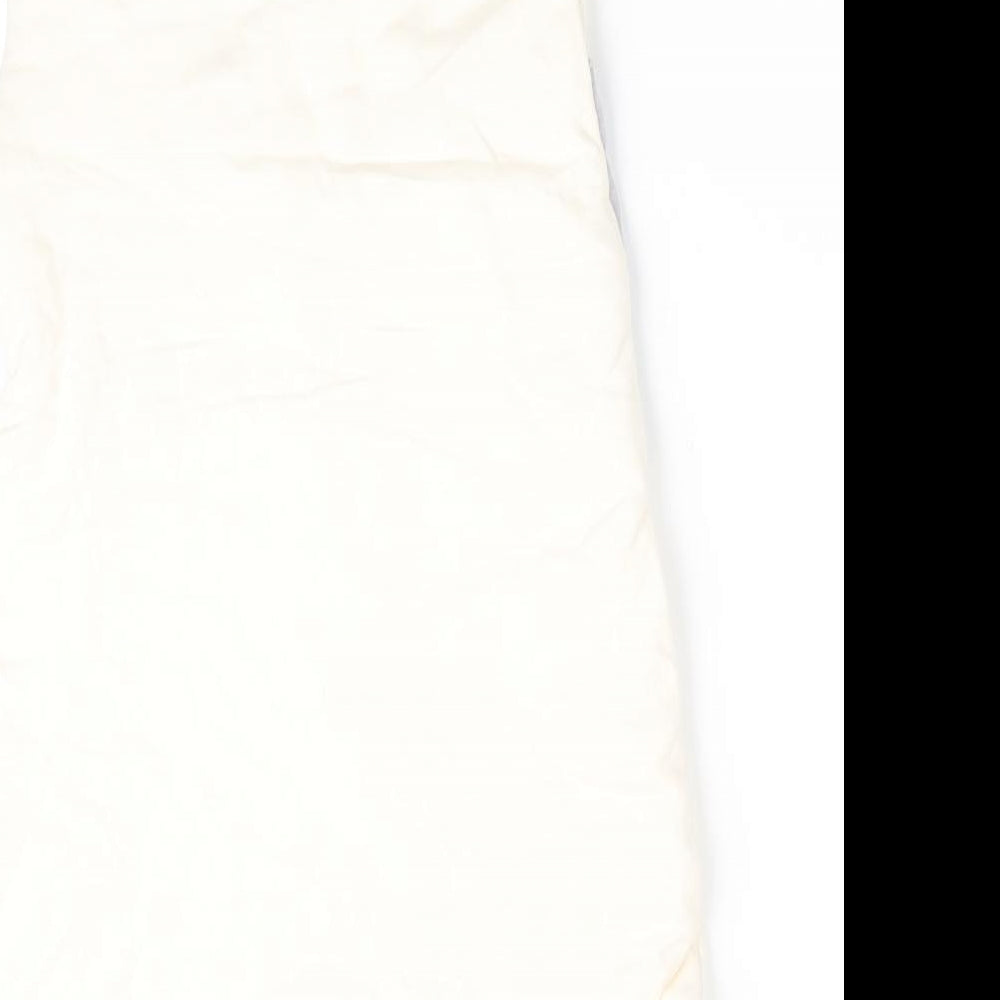 Brand and care label for NP Heart girls’ ivory animal print coverall one-piece, size 0-3, months - elephant print