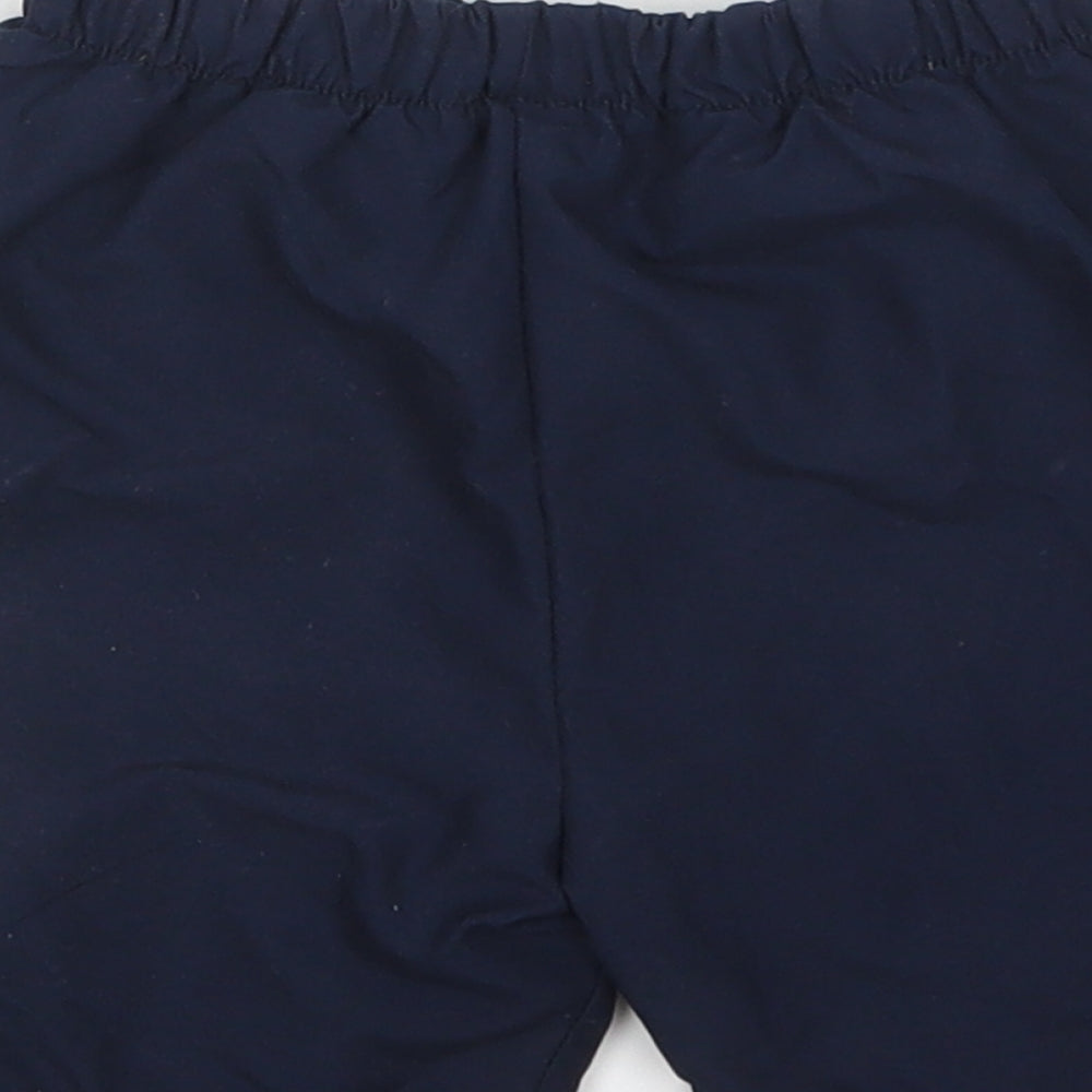 Brand and care label for st mp boys’ blue sweatpants, size 12-18, months