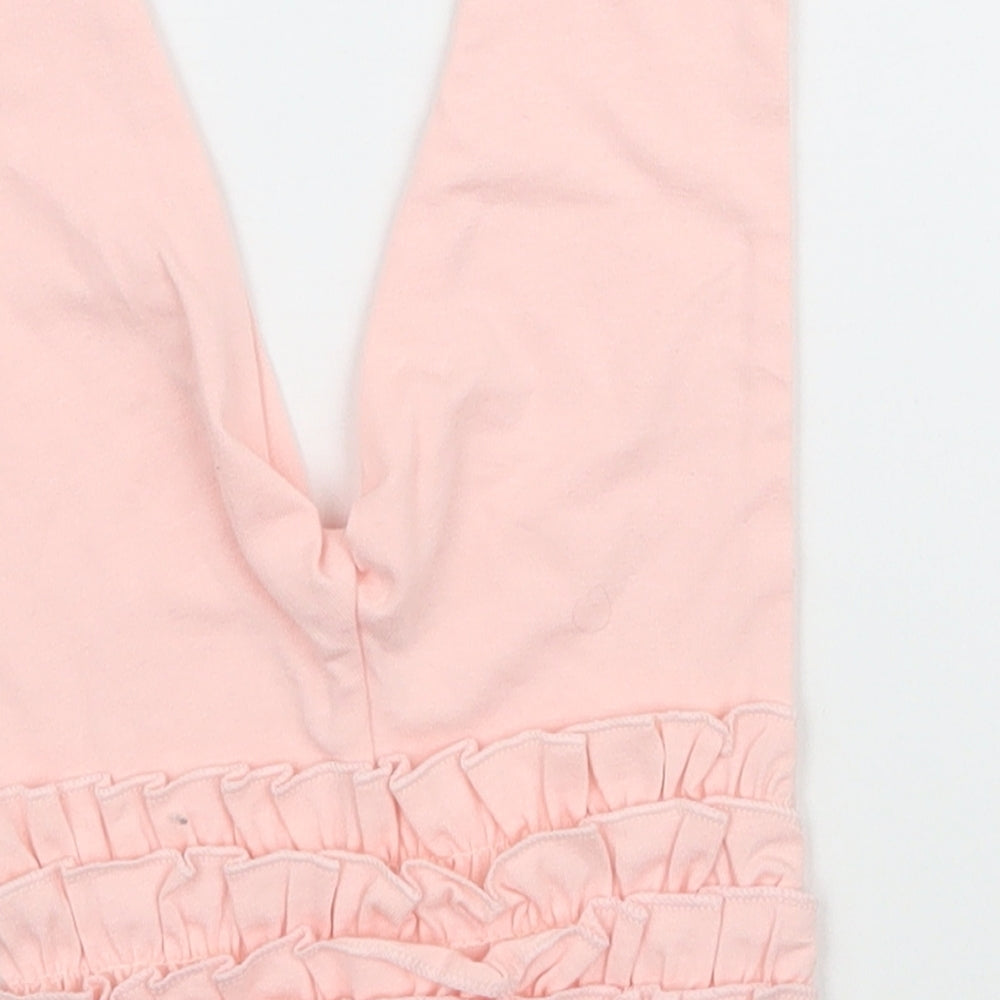 Brand and care label for Primark girls’ pink jogger leggings, size 3-6, months