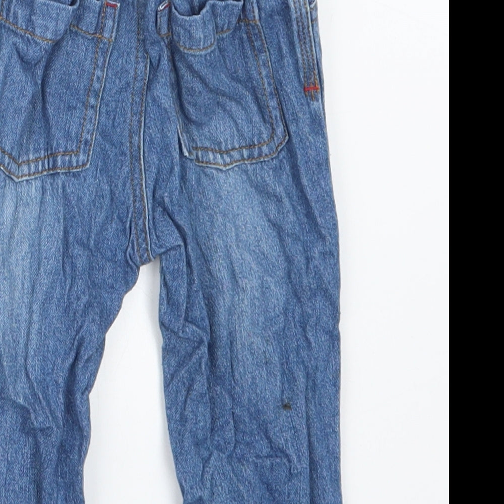 Brand and care label for Nutmeg boys’ blue denim cargo jeans, size 9-12, months