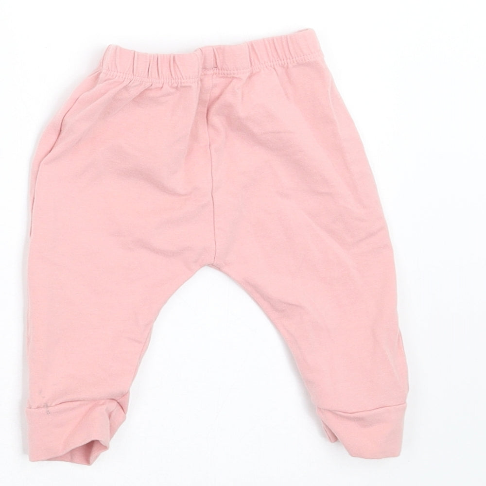 Brand and care label for Preworn girls’ pink jogger trousers, size 3-6, months
