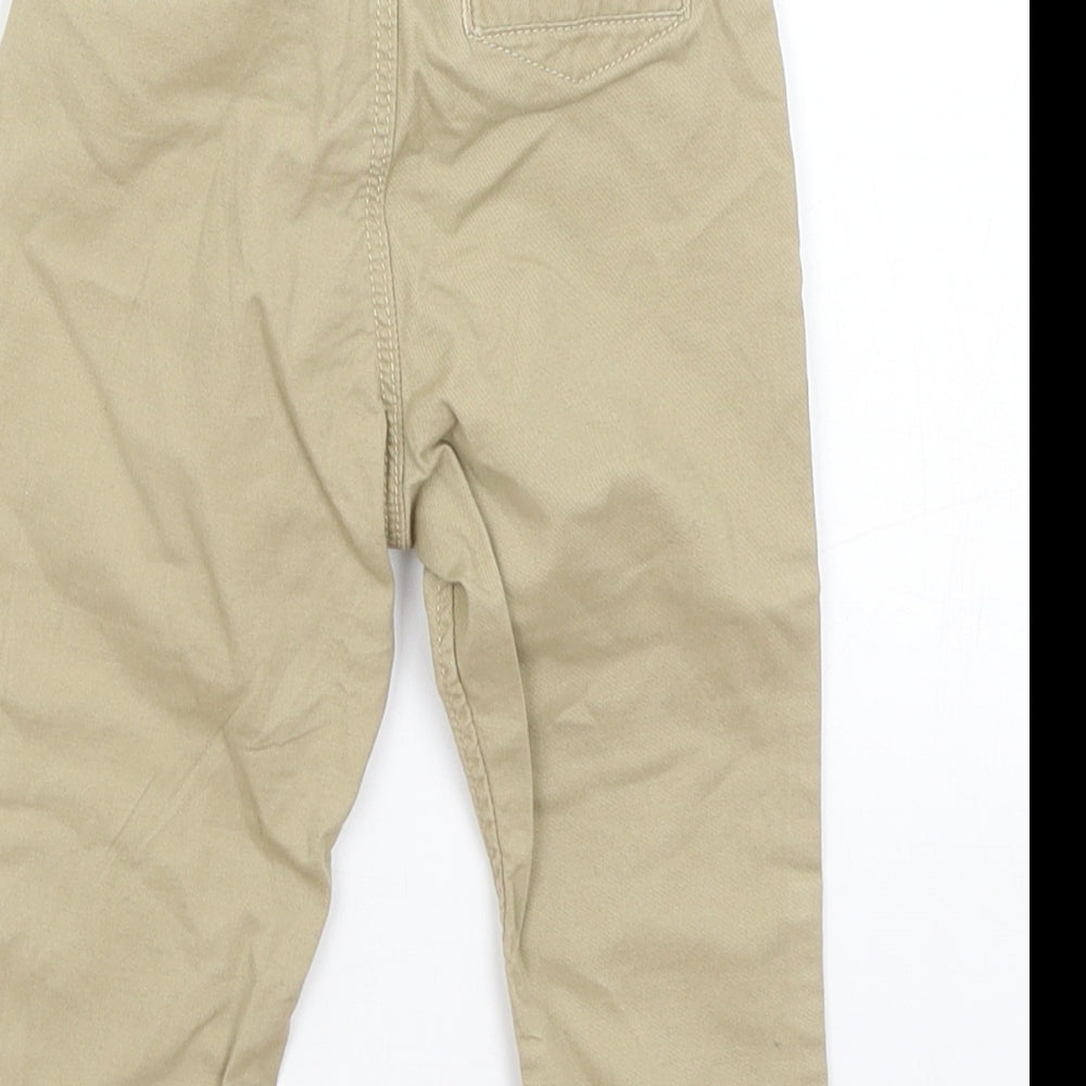 Brand and care label for H&M Baby Beige Capri Trousers, size 6-9, Months