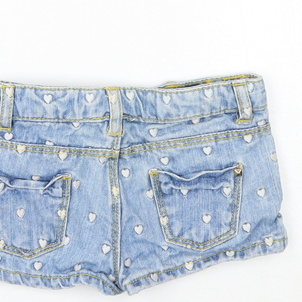 Brand and care label for Zara girls’ blue geometric cropped jeans, size 9-12, months