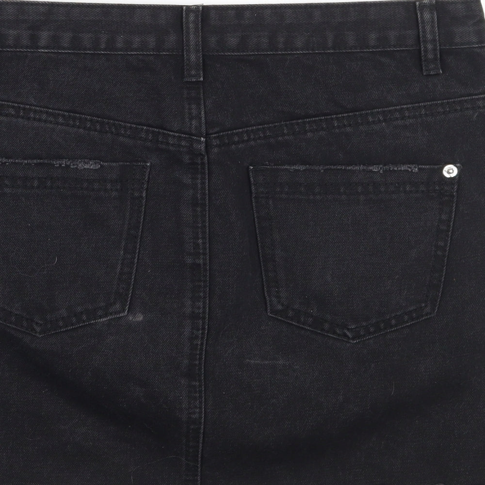 Brand and care label for Missguided women’s black rayon a-line skirt, size UK 10