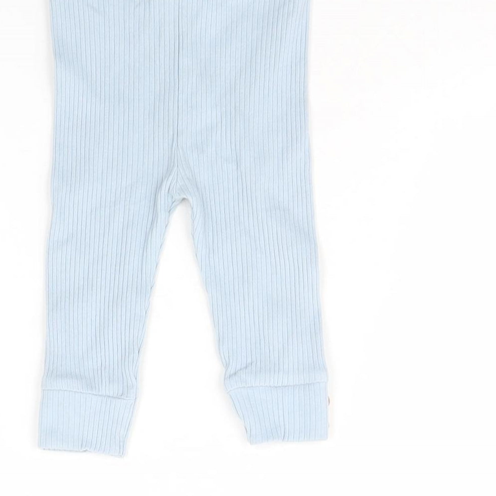 Brand and care label for Tu girls’ blue capri trousers, size 3-6, months